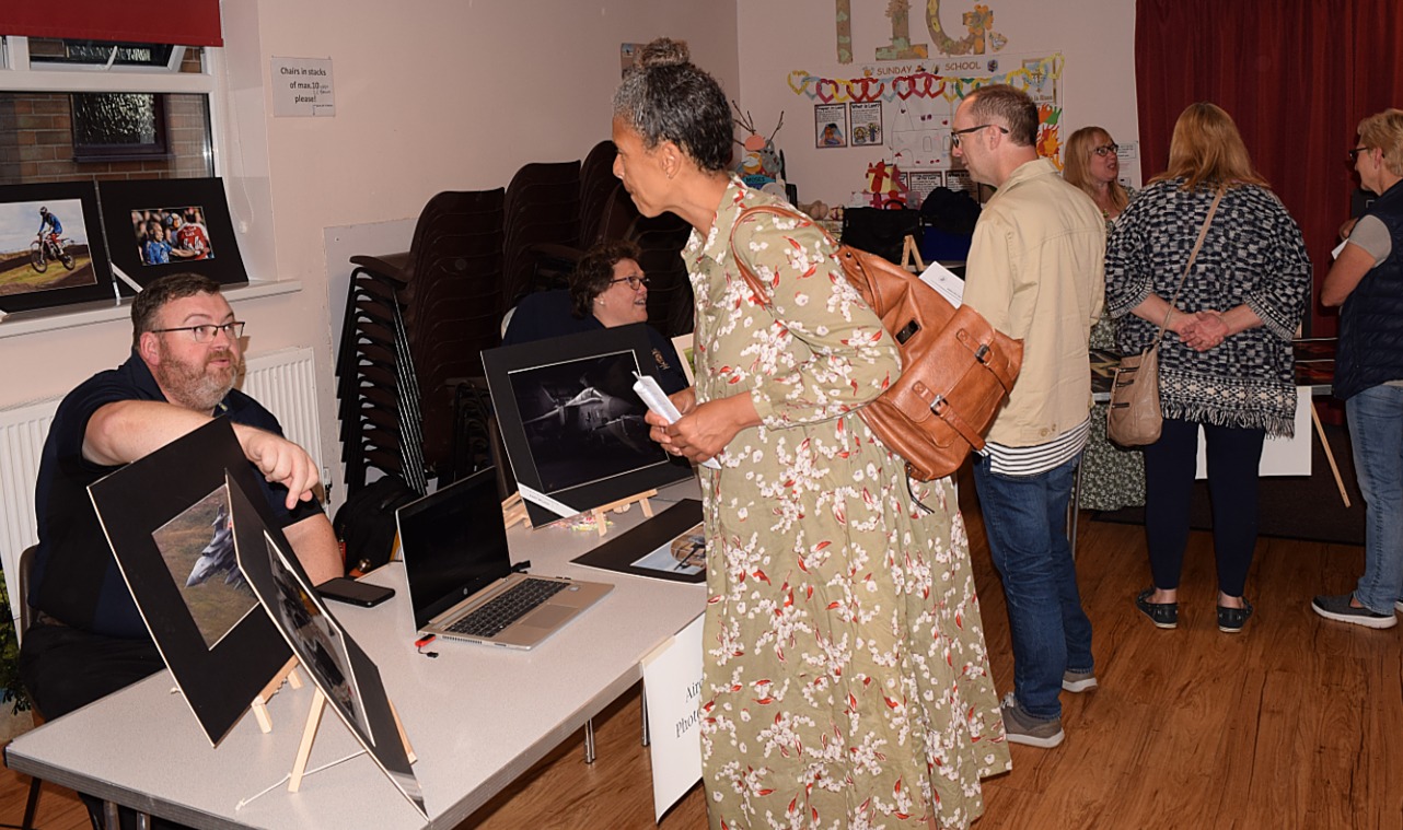 NFPS members talk to guests at the 2022 open night